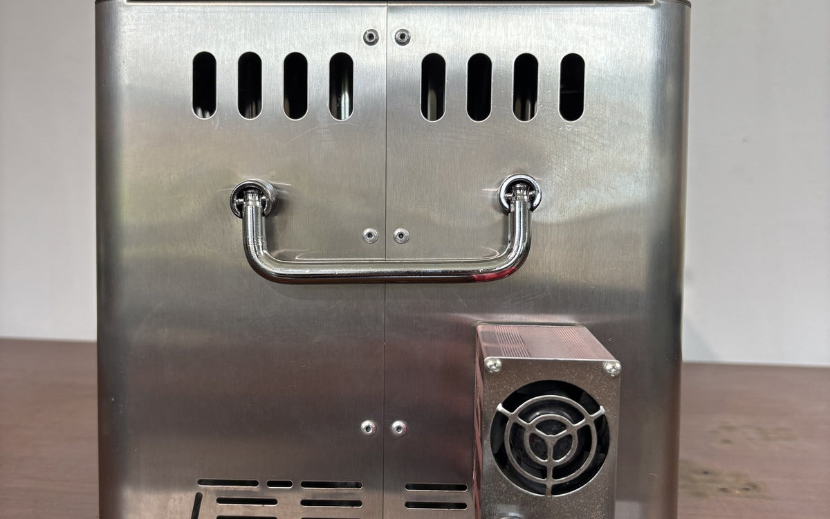 Hillrein Zhengtu wood stove fire control hardware showing the side-mounted fan housing, circular grille and carrying handle