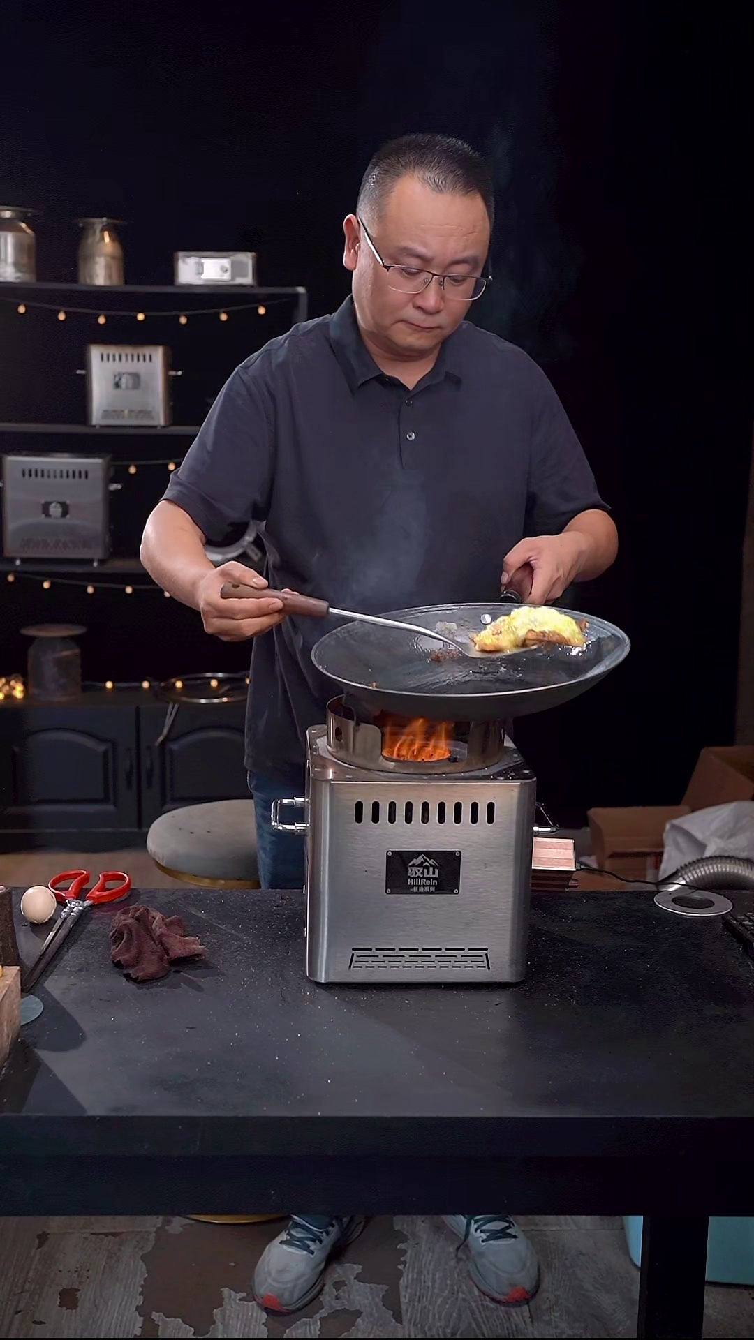 Hillrein wood stove for cooking image showing the Zhengtu wok recovering to a drier high-heat surface before eggs go in