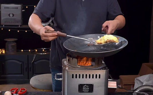 Hillrein wood stove for wok cooking image showing the Zhengtu running a real stir-fry with a fuller first wood load before the high-heat tossing starts