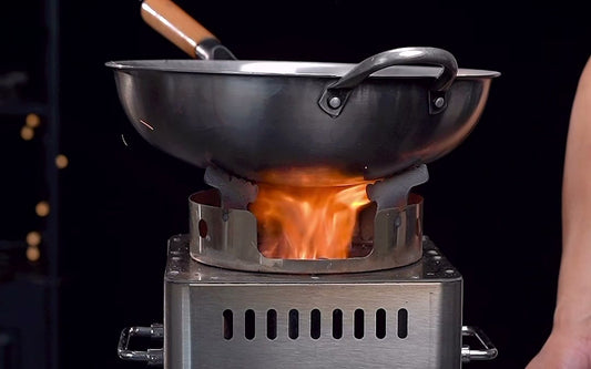 Hillrein wood stove for wok cooking with a round-bottom wok over a stable Zhengtu flame before covered cooking